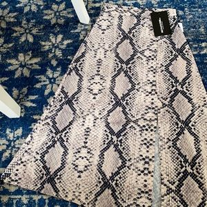 Pretty Little Things- NWT. Snakeskin print w/ slit